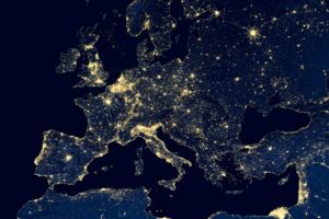 A view from space of mainland Europe and the UK at night, with lights showing population centres.