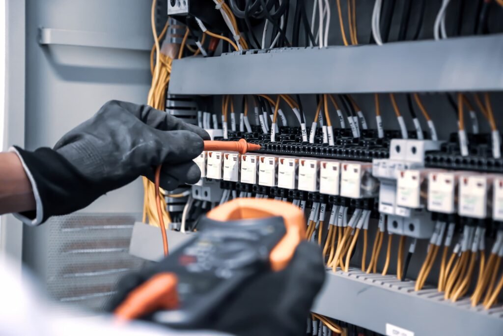An electrical engineer tests the current and voltage of electrical cables.